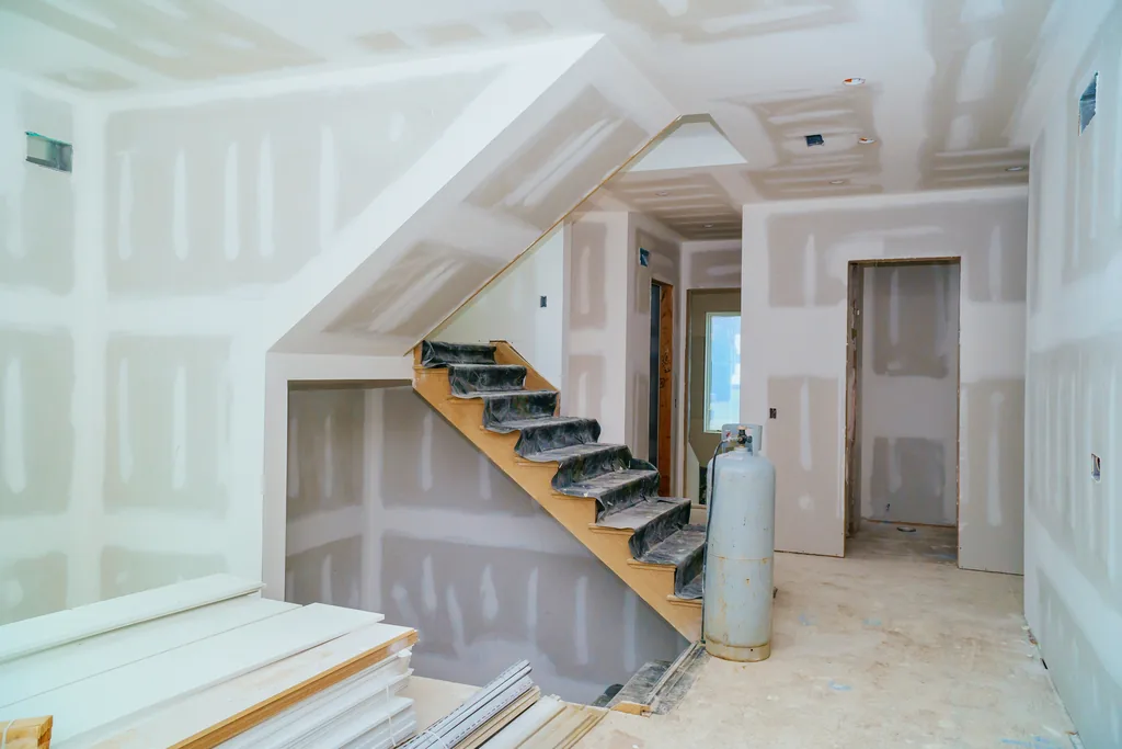 Unfinished interior with taped and floated drywall