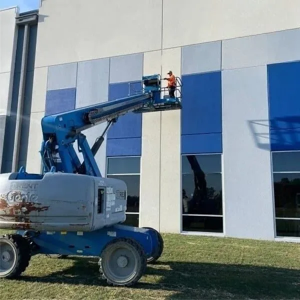 Commercial painters working from a boom lift in Gainesville, FL