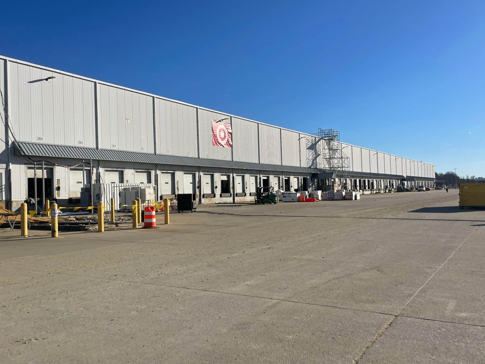 Ladder and scaffolding used for painting high-rise commercial building
