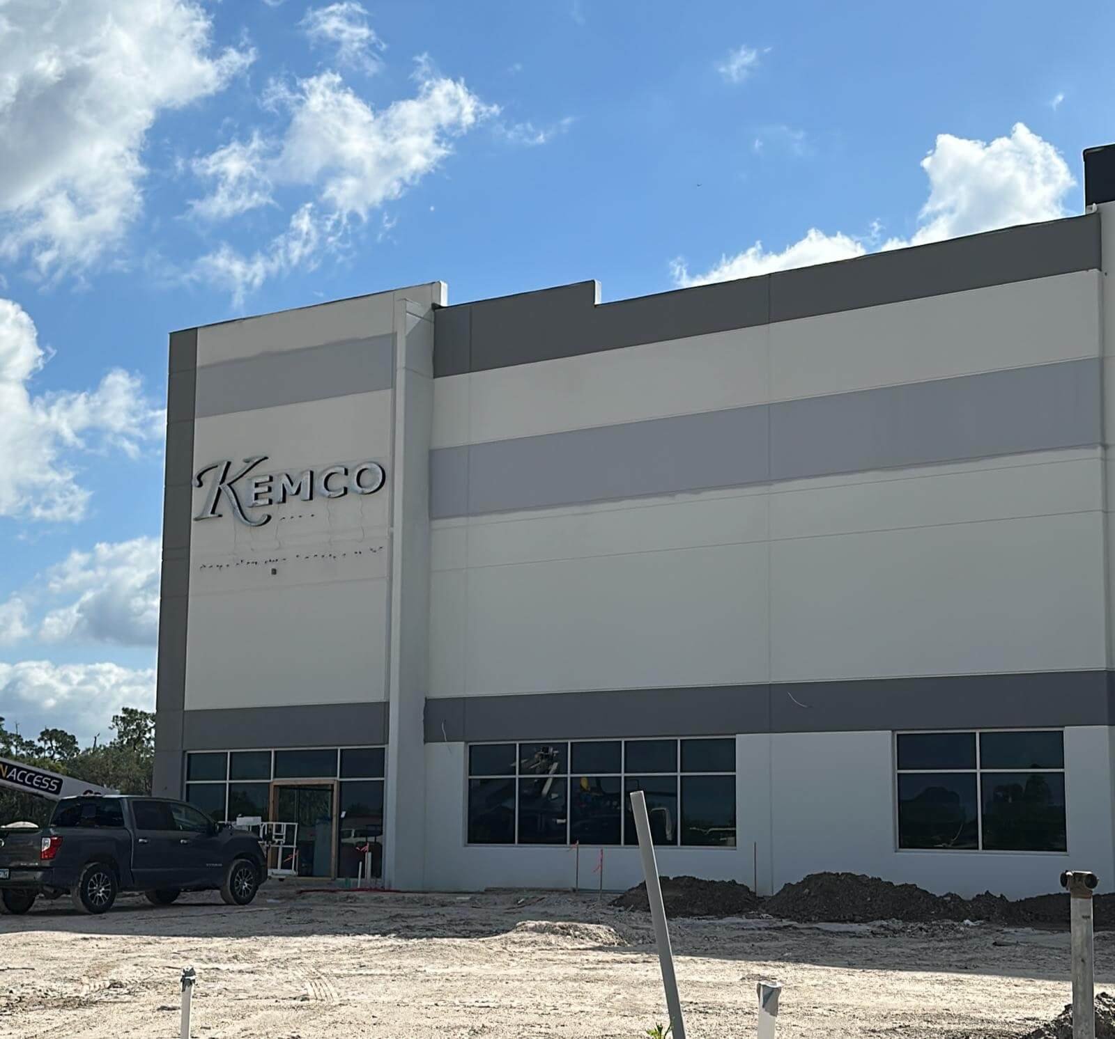 Painting crew collaborating on a commercial building exterior design