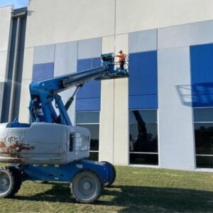 Commercial building exterior painting in progress by professional painters