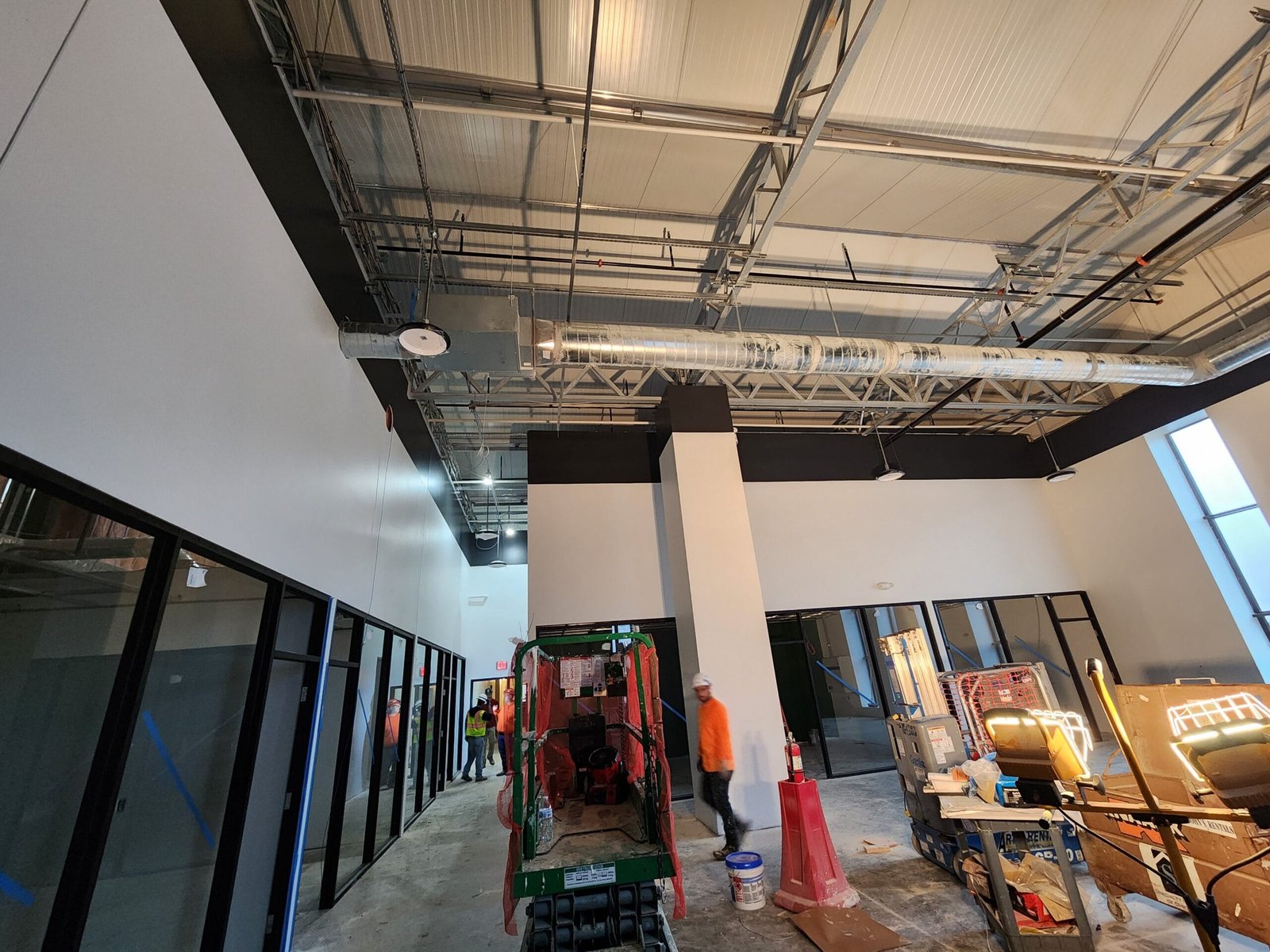 Painter's tools and equipment, including brushes, rollers, and paint cans