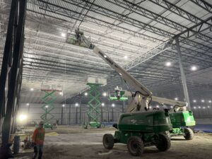 Boom lift and Scissor lift in action during a large-scale commercial interior painting job
